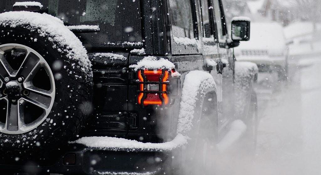 Vehicles on a snow-covered Aspen street in winter