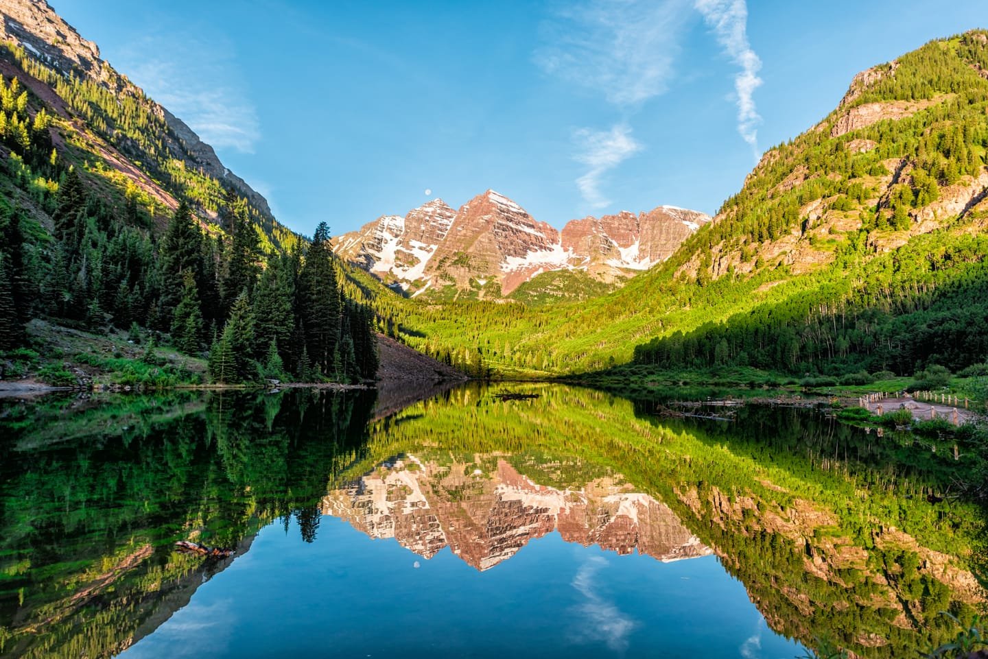 The Maroon Bells reflected in Maroon Lake on a summer morning