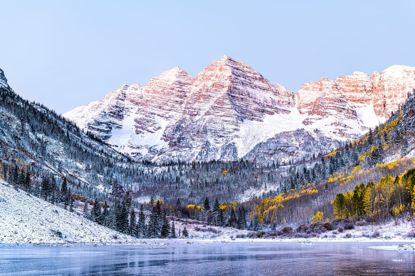 The Maroon Bells at sunrise with early snow