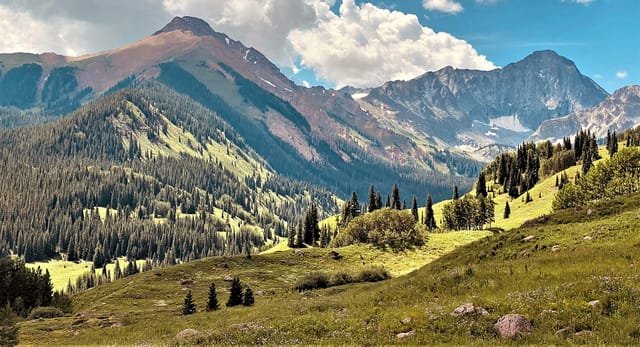 Mt. Daly and Capitol Peak above a summer valley near Aspen
